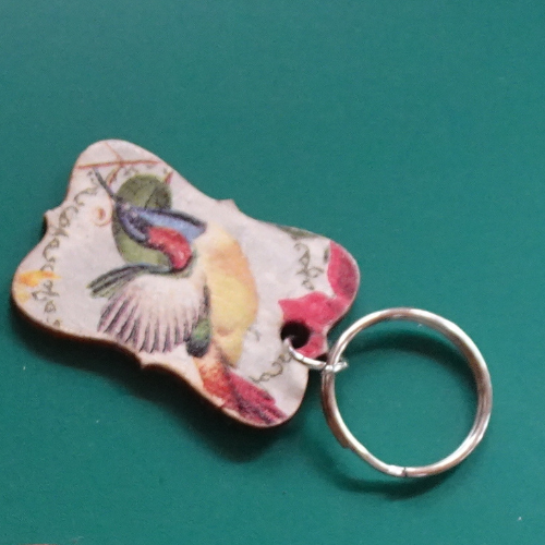 Porte clés oiseau fond vert